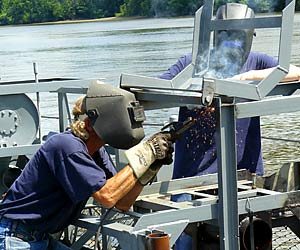 Volunteers fabricate a new rear depth charge rack